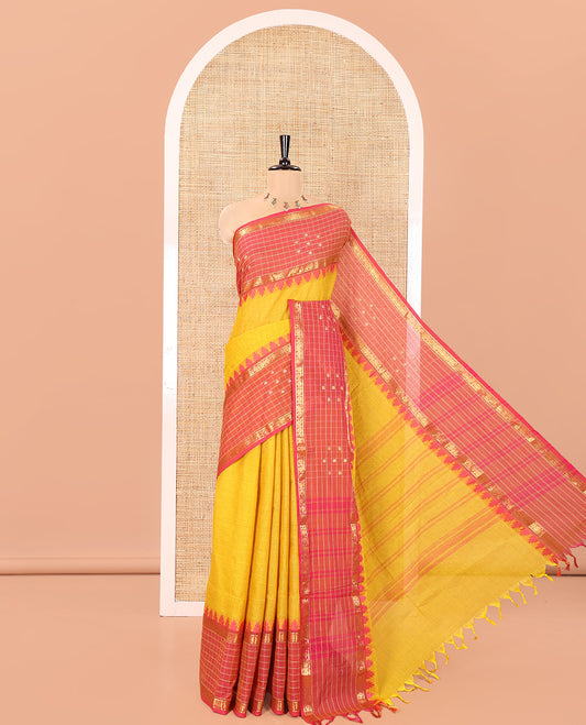 Yellow Plain Chettinad Cotton Saree, Complemented by Contrast Traditional Temple Border of Butta Enclosed Checks, Subtly Striped Pallu, and Paired with a Matching Blouse