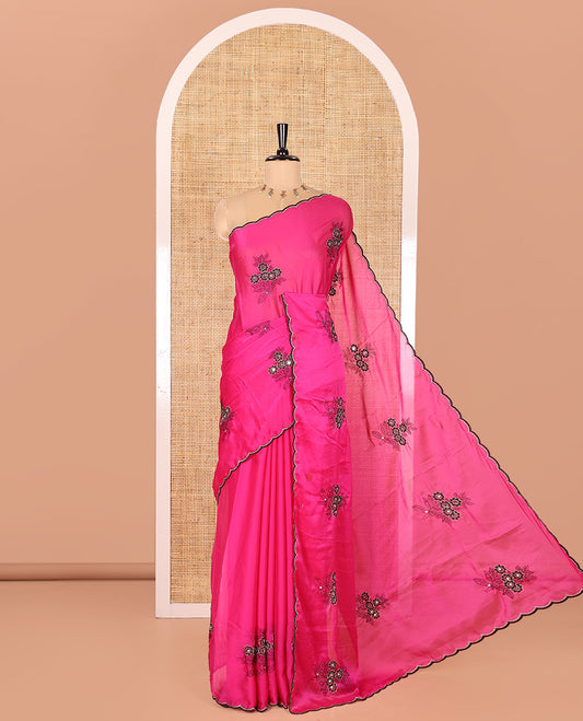 Rani Pink Rangoli Chiffon Saree, Decorated with Flower-Style Motifs Embroidered on Its Body, a Subtle Scallop Embroidered Border, a Self-Pallu, and Paired with a Contrast Embroidered Blouse