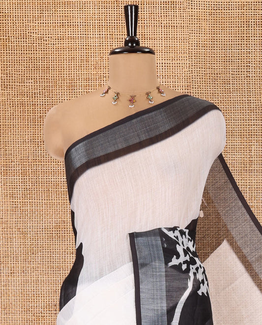 White Linen Cotton Saree, Adorned with Big Floral Prints On Its Body, Complemented by Contrast Zari Bavanji Border, Floral Printed Pallu, and Paired with a Hand Block Printed Blouse