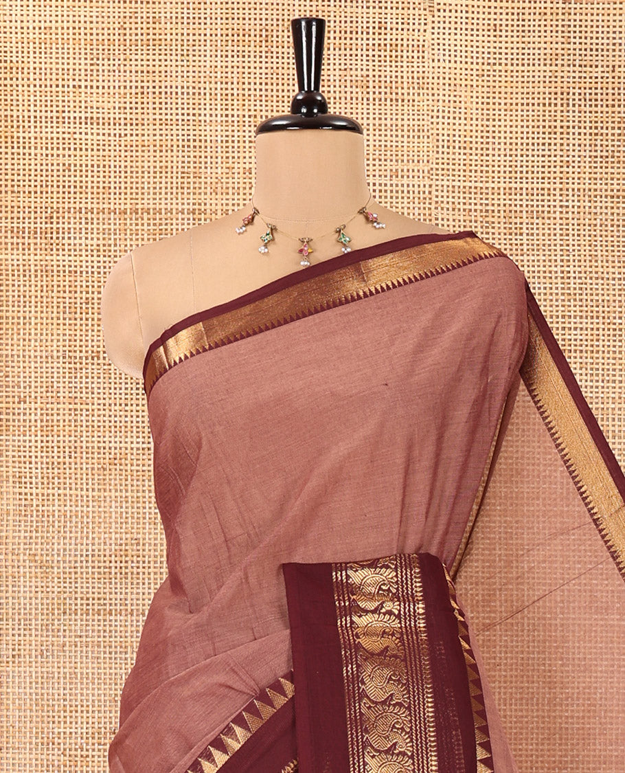 Mauve Plain Chettinad Cotton Saree, Complemented by Contrast Rettai Pettu Traditional Zari Border of Temple and Peacock Designs, Striped Pallu, and Paired with a Matching Blouse