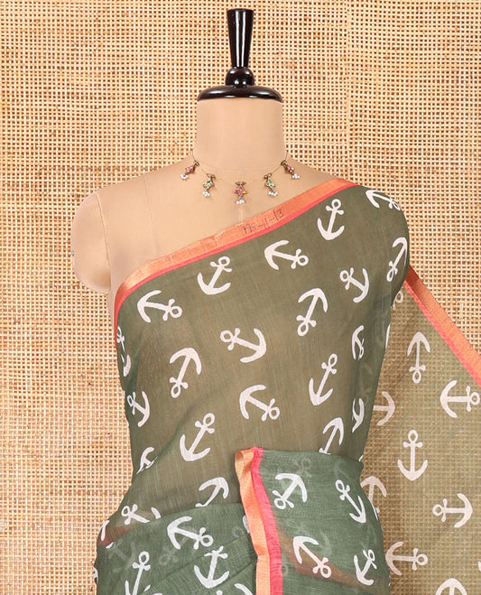 Olive Green Linen Cotton Saree, Steeped with Anchor Motifs Printed on Its Body, a Subtle Contrast Piping Border, Multi-Color Striped Pallu, and Paired with a Contrast Blouse