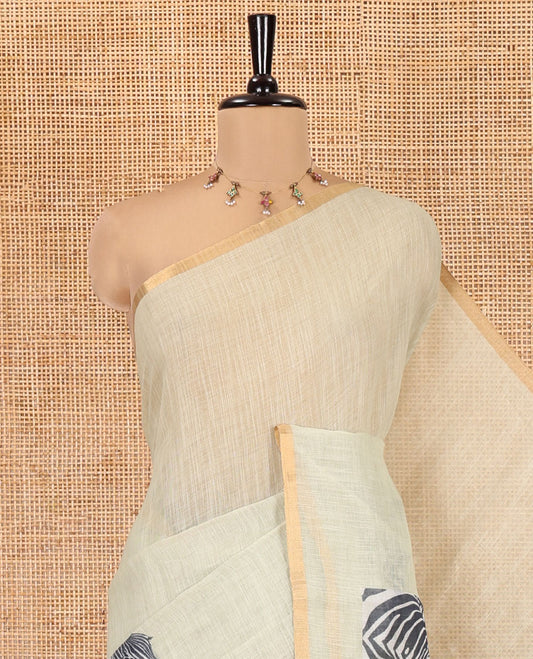 Pista Green Linen Cotton Saree, Accentuated with Zebra Motifs Print, A Subtle Piping Border, Zebra Printed Pallu, and Comes with a Contrast Blouse