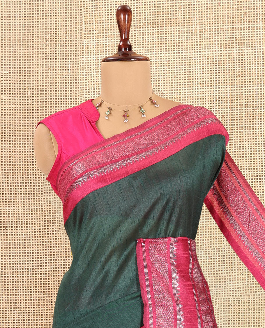 Bottle Green Plain Semi-Raw Silk Saree, a Contrast Silver Zari Border, a Contrast Pallu, and a Contrast Blouse