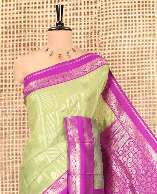 Olive Green Litchi Saree, Woven with Vaira Oosi Stripes and Zari Buttas on Its Body, Complemented by a Contrast Rettai Pettu Traditional Zari Design Border, an Intricately Designed Pallu, and Paired with a Contrast Blouse