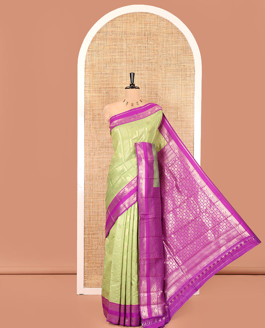 Olive Green Litchi Saree, Woven with Vaira Oosi Stripes and Zari Buttas on Its Body, Complemented by a Contrast Rettai Pettu Traditional Zari Design Border, an Intricately Designed Pallu, and Paired with a Contrast Blouse