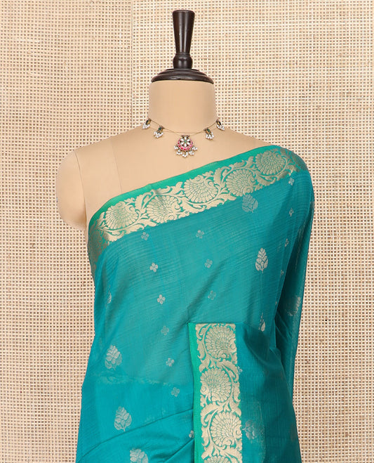Blue Silk Cotton Saree Prettified with Floral Buttas All Over the Body, Complemented by a Contrast Floral Creeper Border, Featuring a Contrast Pallu of Floral Zari Designs, and Paired with a Contrast Blouse