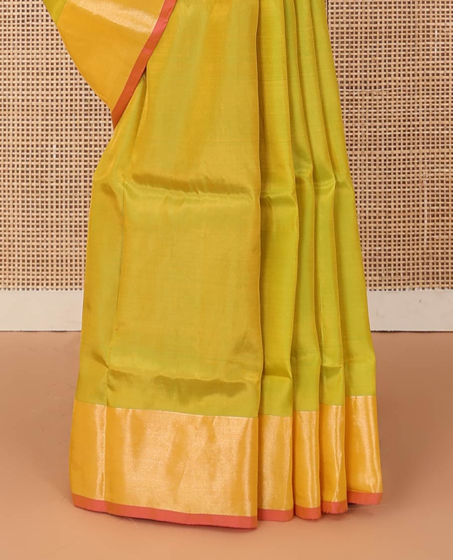 Light green zari buttas Uppada saree, contrast bavanji border, and intricate pallu