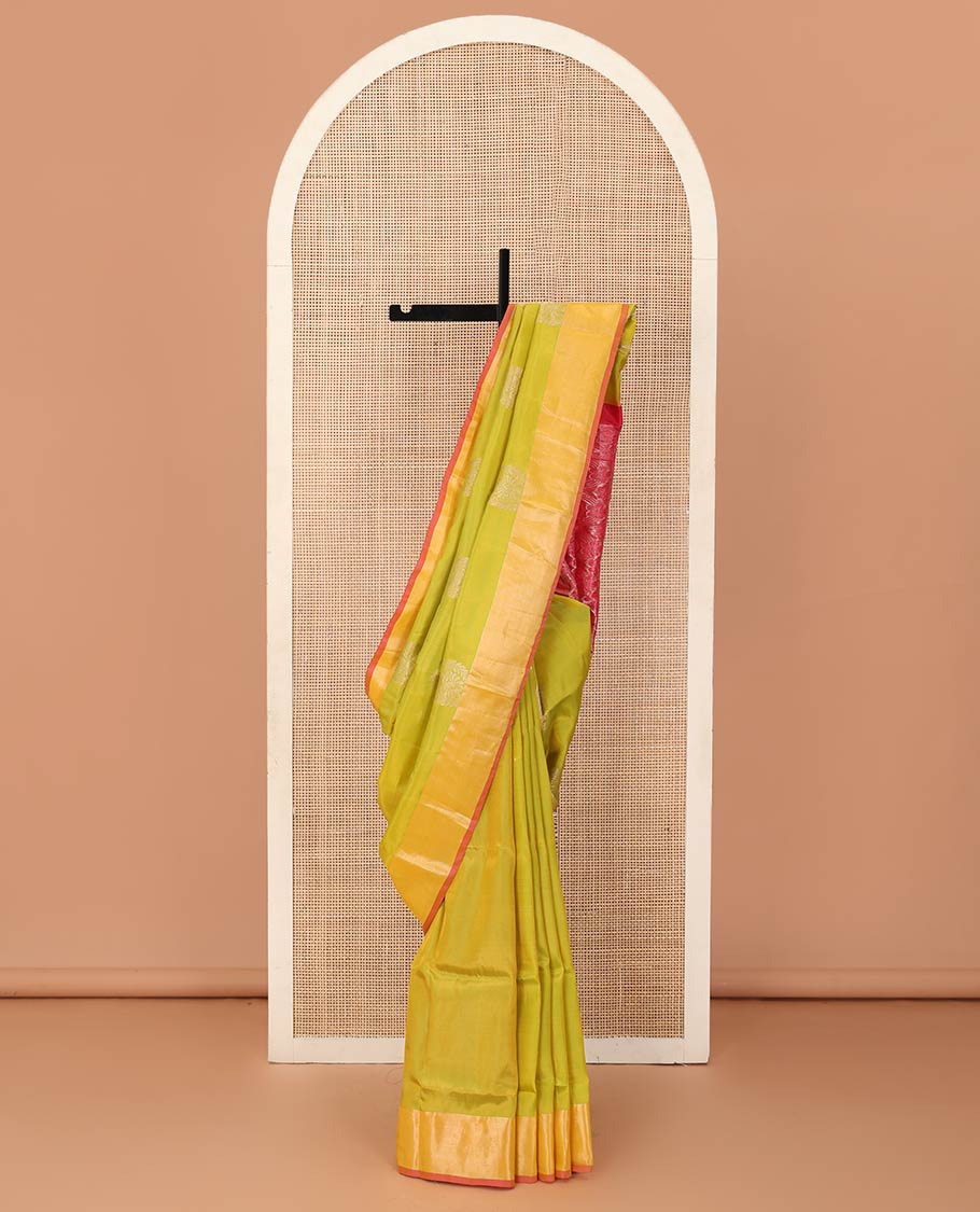 Light green zari buttas Uppada saree, contrast bavanji border, and intricate pallu