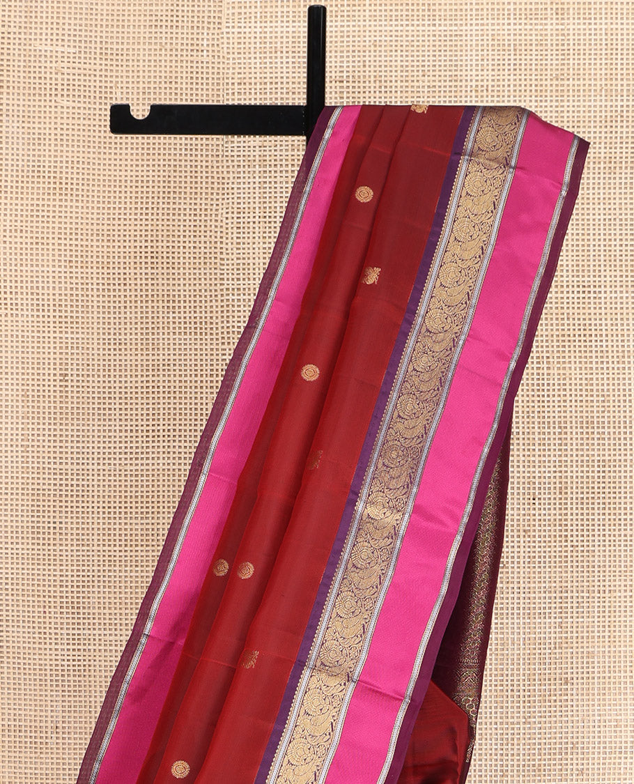 Maroon Vasundhara Lite Silk Mix Saree, Accentuated with Annam Chakram Zari Buttas, Complemented by a Contrast Rettai Pettu Border of Rekku, Kathir, and Mayil Designs, Meticulously Designed Pallu, and Paired with a Contrast Blouse