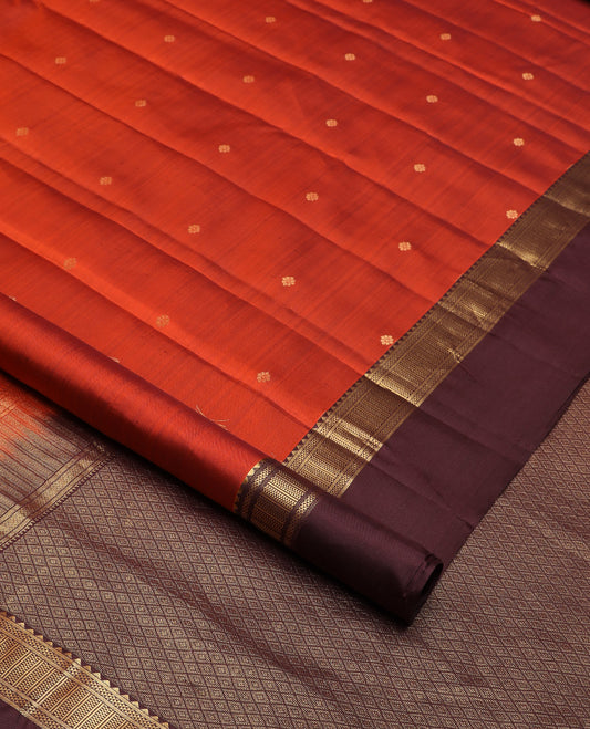 Orange zari buttas silk saree, contrast border of reeku, banaras, and ara maadam designs, and jaal pallu