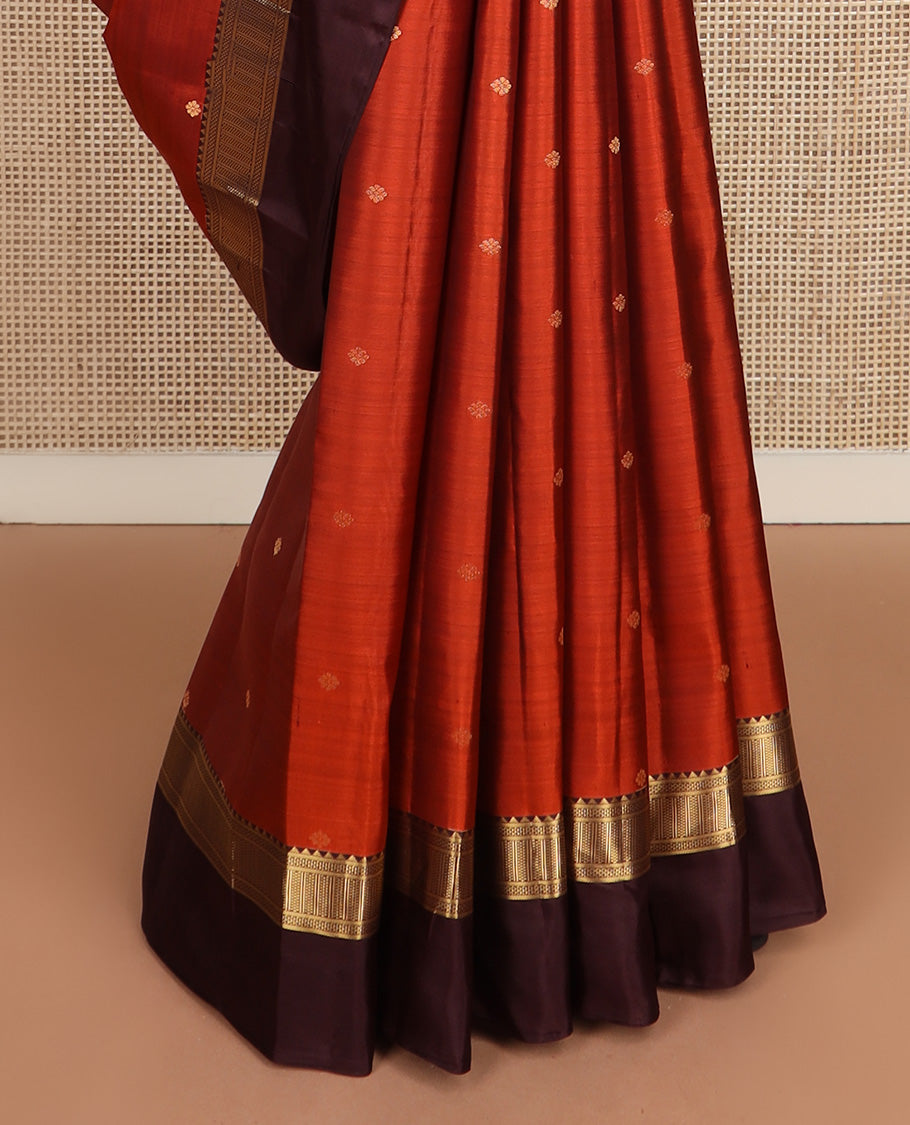 Orange zari buttas silk saree, contrast border of reeku, banaras, and ara maadam designs, and jaal pallu
