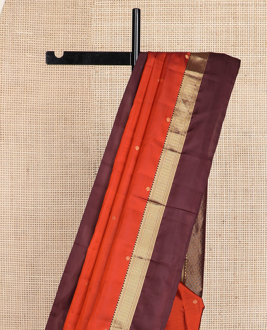 Orange zari buttas silk saree, contrast border of reeku, banaras, and ara maadam designs, and jaal pallu
