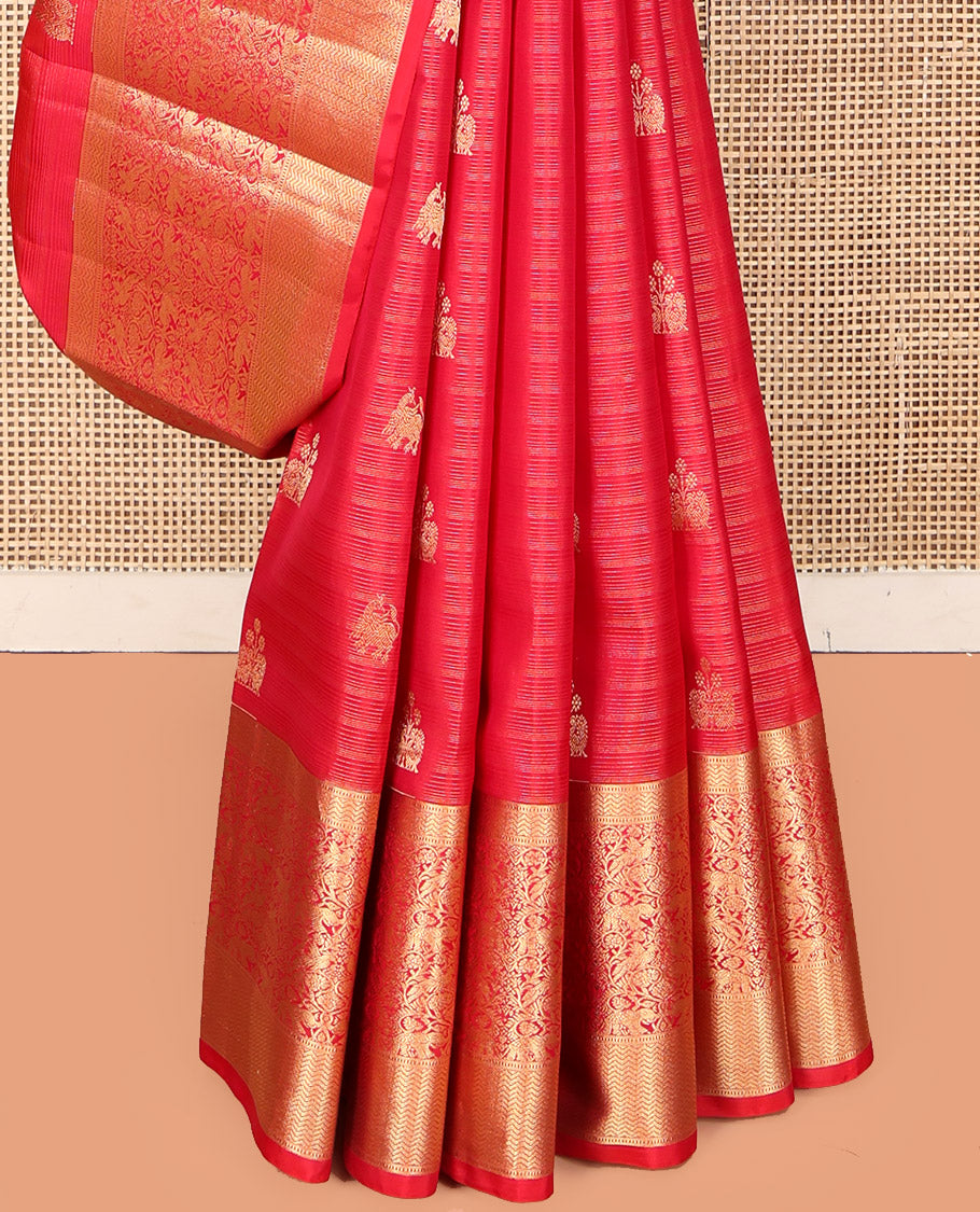 Red Vasundhara Silk Saree, Elegantly Highlighted with Zari Buttas, Highlighted by a Vanasingaram-Style Zari Vanki Border, Jaal Pallu, and a Matching Blouse