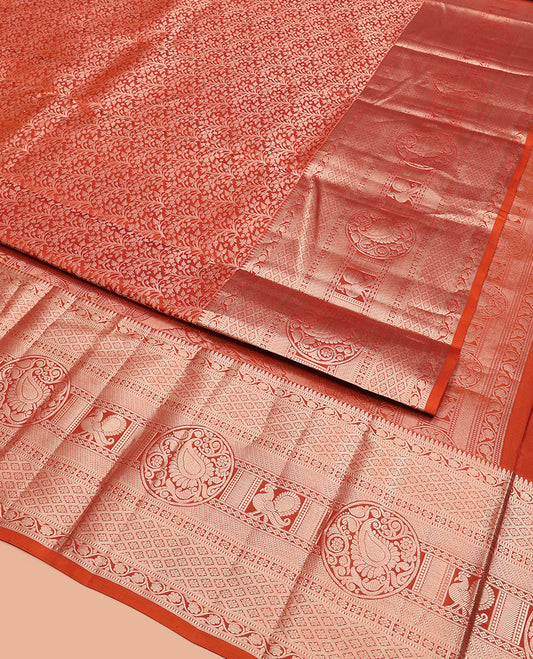 Rust Orange Kanchipuram Silk Saree Elegantly Designed with Jacquard Design, Highlighted with Zari Border of Thilakam, Muthu, Kodi Visiry, Jaal, Manga, and Mayil Designs, Majestically Detailed Pallu, and Paired with a Matching Blouse