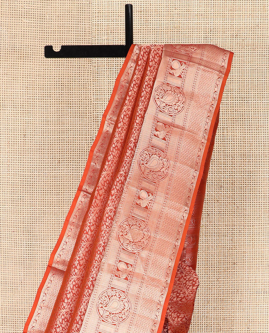Rust Orange Kanchipuram Silk Saree Elegantly Designed with Jacquard Design, Highlighted with Zari Border of Thilakam, Muthu, Kodi Visiry, Jaal, Manga, and Mayil Designs, Majestically Detailed Pallu, and Paired with a Matching Blouse