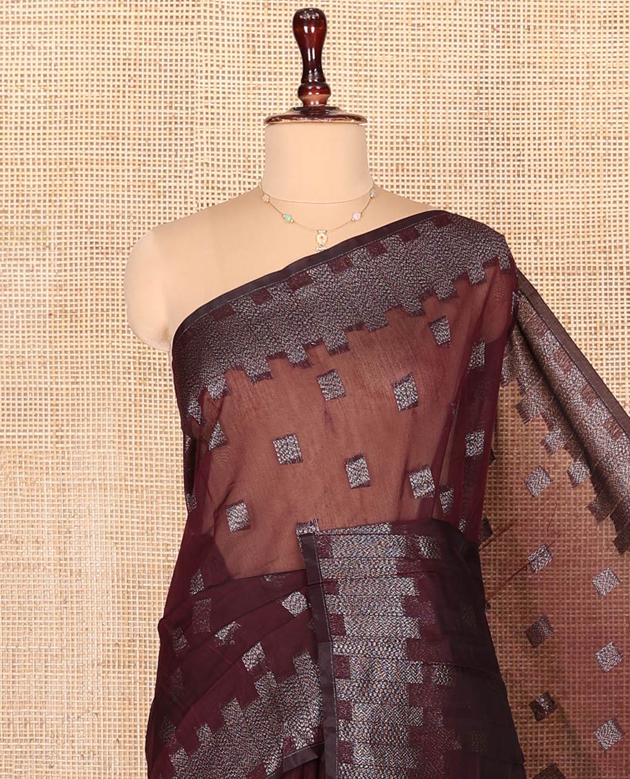 Maroon Semi-Silk Cotton Saree, Detailed with Buttas on Its Body, Highlighted by a Zari Geometric Border, Gleaming Zari Decked Up Pallu, and Paired with a Matching Blouse