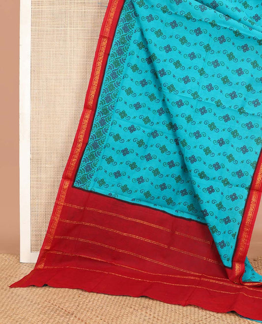 Blue four-petal floral printed Sungudi cotton saree, contrast floral creeper zari border & striped pallu