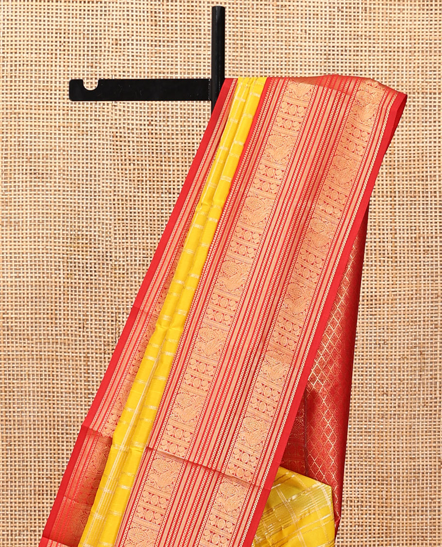 Lemon Yellow and Red Vasundhara Lite Silk Saree, Richly Detailed with Zari Checked Design On Its Body, Complemented by Contrast Varisai Pettu Border of Mayil Chakram Designs, Grand Jaal Pallu, and Paired with a Contrast Blouse