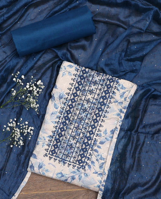 White and blue material chudidar set, floral print, cut work and embroidered top, contrast plain bottom, and sequins striped dupatta