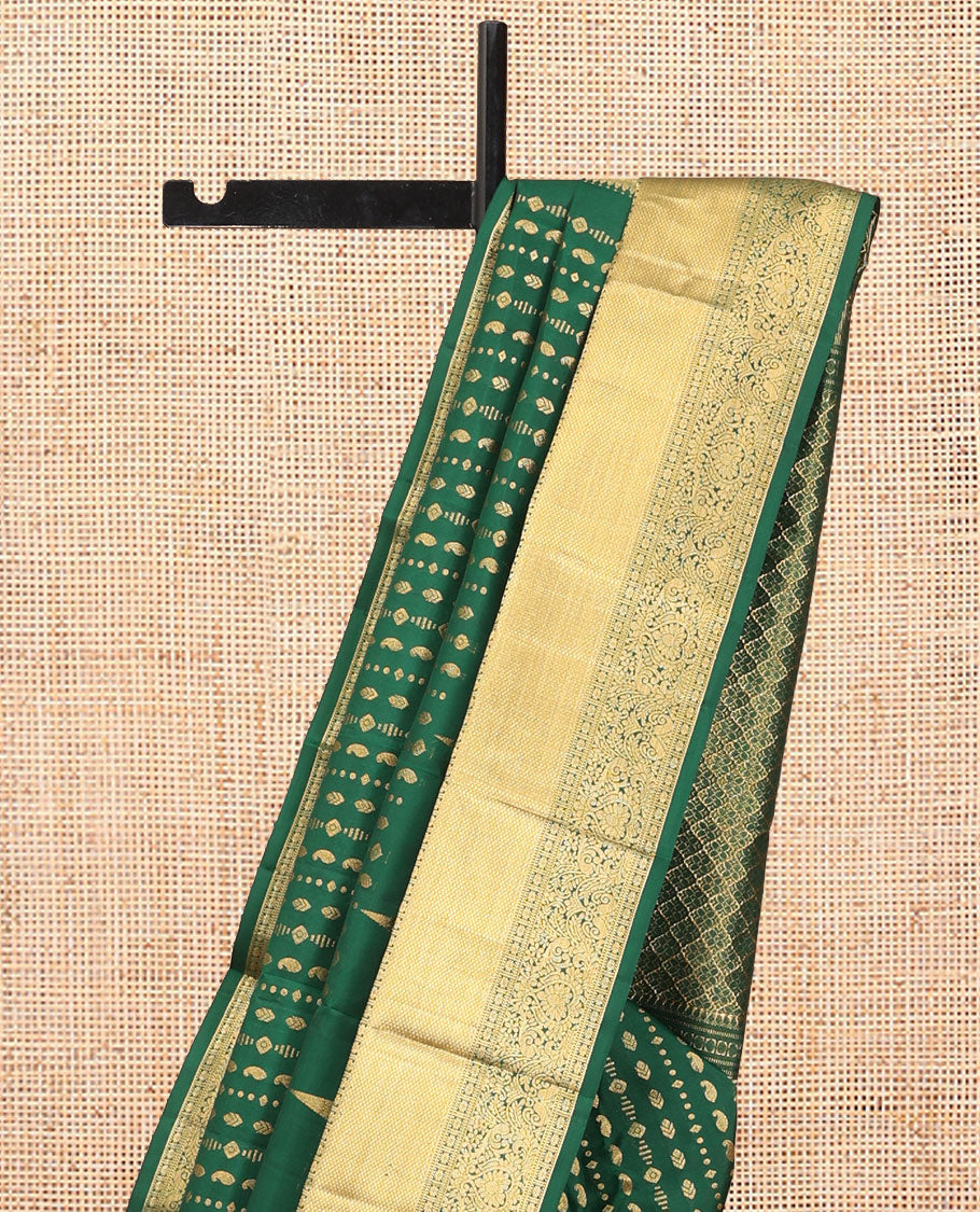 Green Vasundhara Silk Saree, Woven with Zari Buttas, a Zari Thazampoo Rekku Border of Kuyil Kann, Muthu, Star Vanki, and Jada Nagam Designs, Grand Pallu, and a Matching Blouse