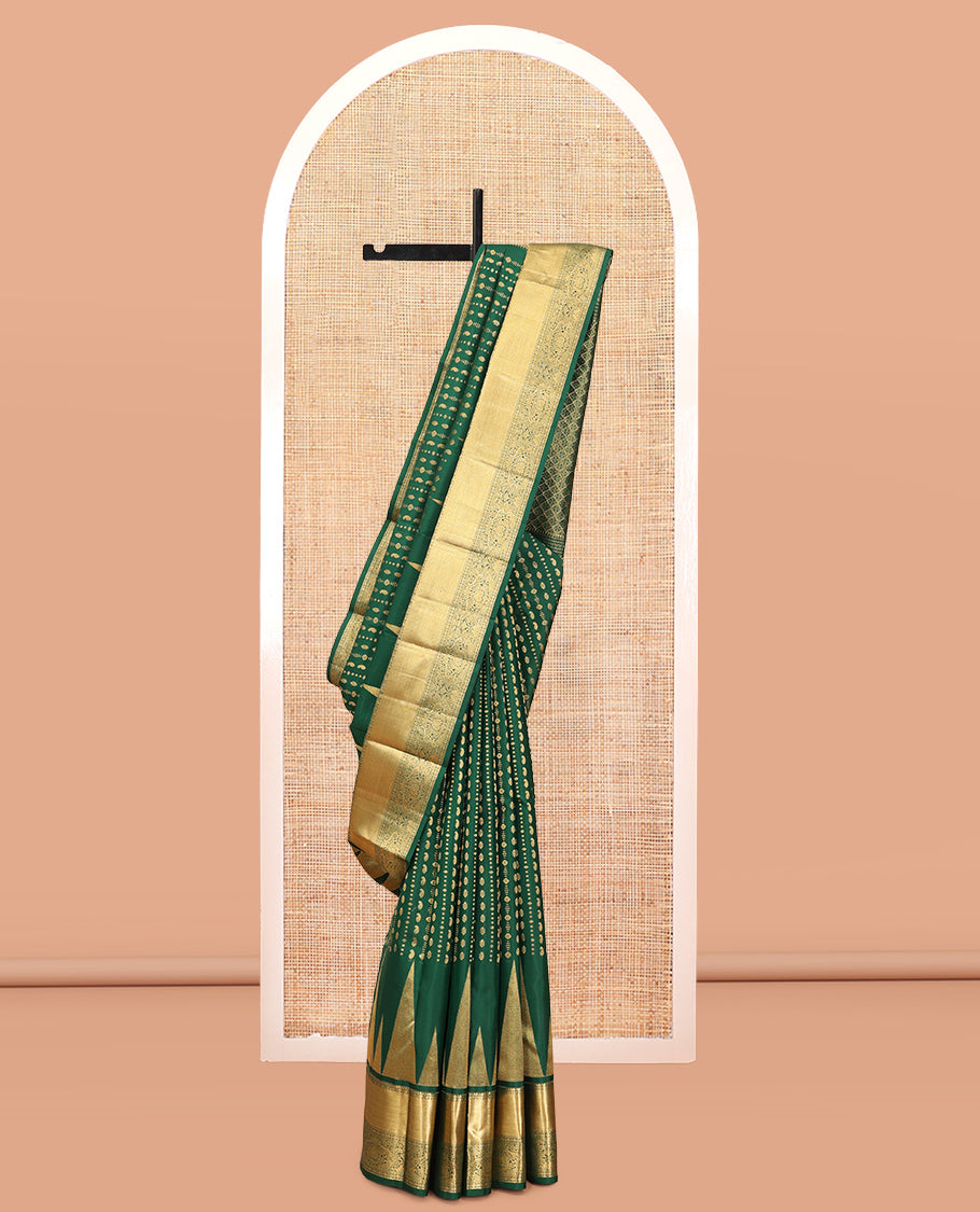 Green Vasundhara Silk Saree, Woven with Zari Buttas, a Zari Thazampoo Rekku Border of Kuyil Kann, Muthu, Star Vanki, and Jada Nagam Designs, Grand Pallu, and a Matching Blouse