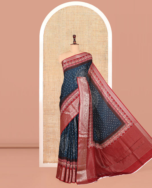 Blue Dola Silk Saree, Detailed with Bandhani Dots on Its Body, Complemented by Contrast Border, Zari Striped  Pallu, and Paired with a Contrast Blouse
