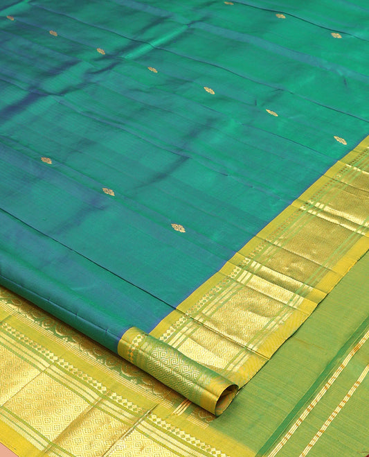 Green Kanchipuram Silk Saree, Detailed with Zari Buttas, a Contrast One-Sided Border of Panner Sombu, Banaras, and Jaal Designs, a Zari Design Pallu, and No Blouse