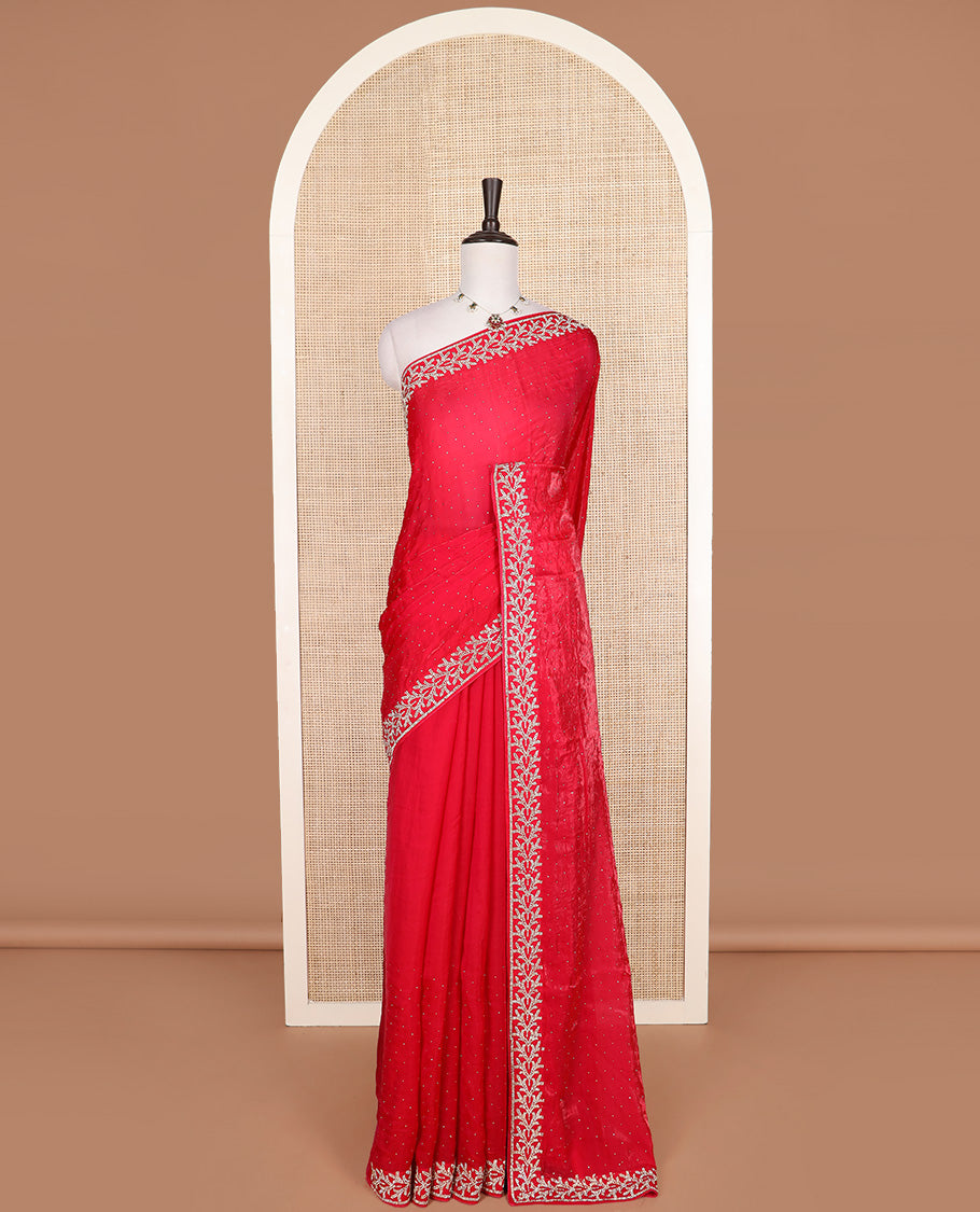 Red stone work designer saree, floral motifs micro-stone work border