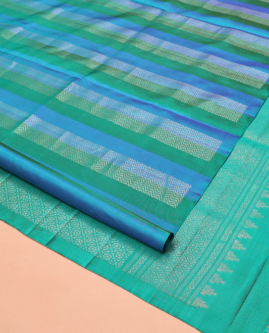 Borderless Blue Mayuri Soft Silk Saree, Adorned with Vanki Designs On Its Body, Complemented by Grandly Decked Up Pallu and Paired with a Contrast Blouse