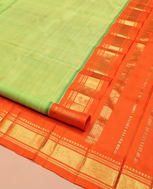 Green Kanchipuram Silk Saree, Finely Crafted with Zari Buttas on Its Body, Complemented by a Contrast One-Sided Korvai Border of Panner Sombu, Banaras, Muthu, and Mayil Kann Designs, Pallu Steeped with Zari Designs, and Comes Without a Blouse