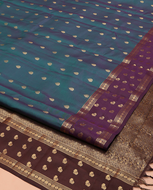 Blue Vasundhara Lite Silk Mix Saree, Accentuated with Zari Buttas on Its Body, Complemented by a Contrast Border of Rekku, Neli, Chakram, and Mayil Designs, Intricately Designed Pallu, and Paired with a Contrast Blouse
