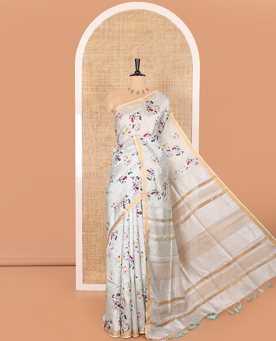 Grey Banana Pith Saree Prettified with Multi-Color Floral Vine Print, Subtle Small Bavanji Border, Gleaming Zari Striped Pallu, and Complemented with a Contrast Floral-Printed Blouse