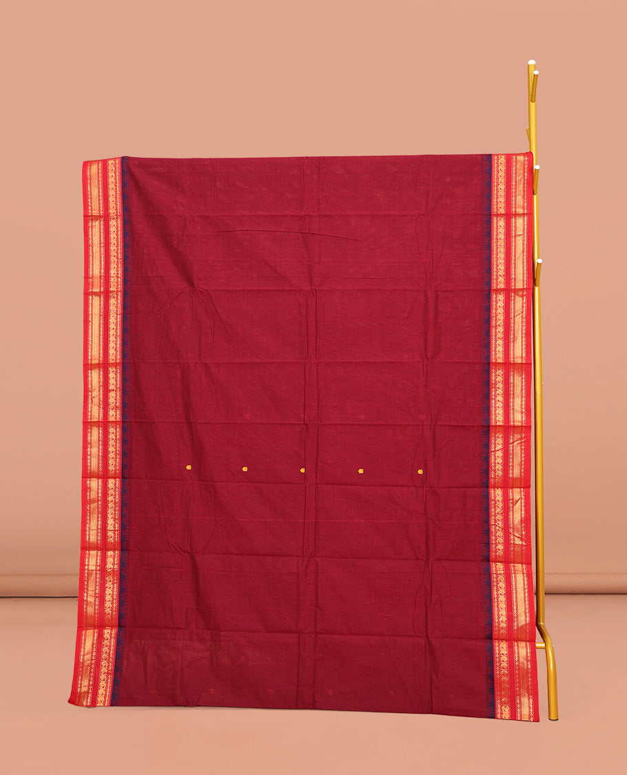 Red Chettinad Cotton Saree, Adorned with Buttas on Its Body, Complemented by a Contrast Traditional Zari Design Woven Border, Pallu of Stripes and Buttas, and Paired with a Matching Blouse