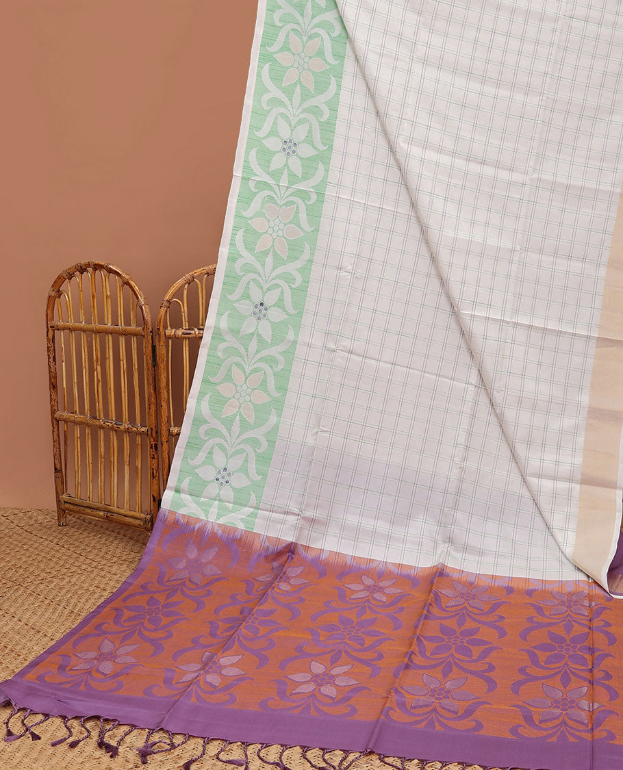 Cream-checked soft silk saree, floral ikkat design border & contrast floral design pallu