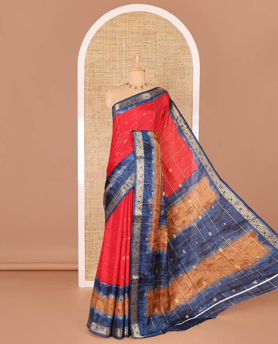 Red buttas enclosed checked dola silk saree, contrast shibori print with traditional zari border, buttas enclosed checked pallu, and a contrast buttas enclosed checked blouse