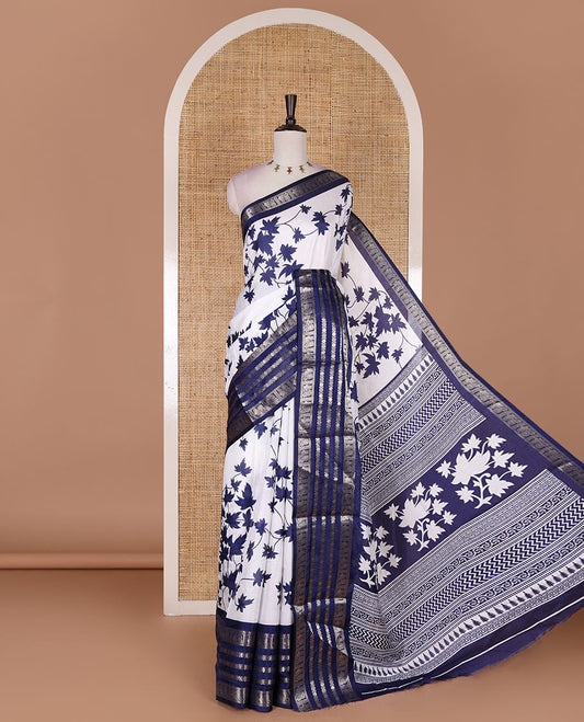 Navy blue leaf motifs printed dola silk saree, contrast traditional zari border of Rudraksham and peacock motifs, geometric printed pallu and contrast printed blouse