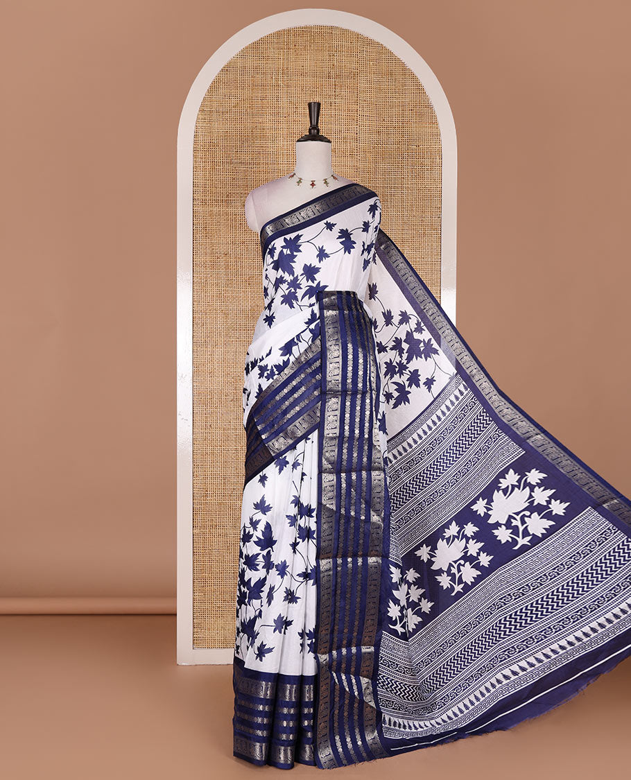Navy blue leaf motifs printed dola silk saree, contrast traditional zari border of Rudraksham and peacock motifs, geometric printed pallu and contrast printed blouse