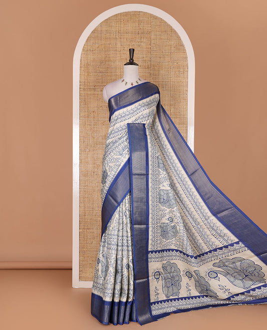 Cream-blue flora, fauna, and geometric madhubani printed soft tussar saree, contrast zari border, peacock print pallu, and printed blouse