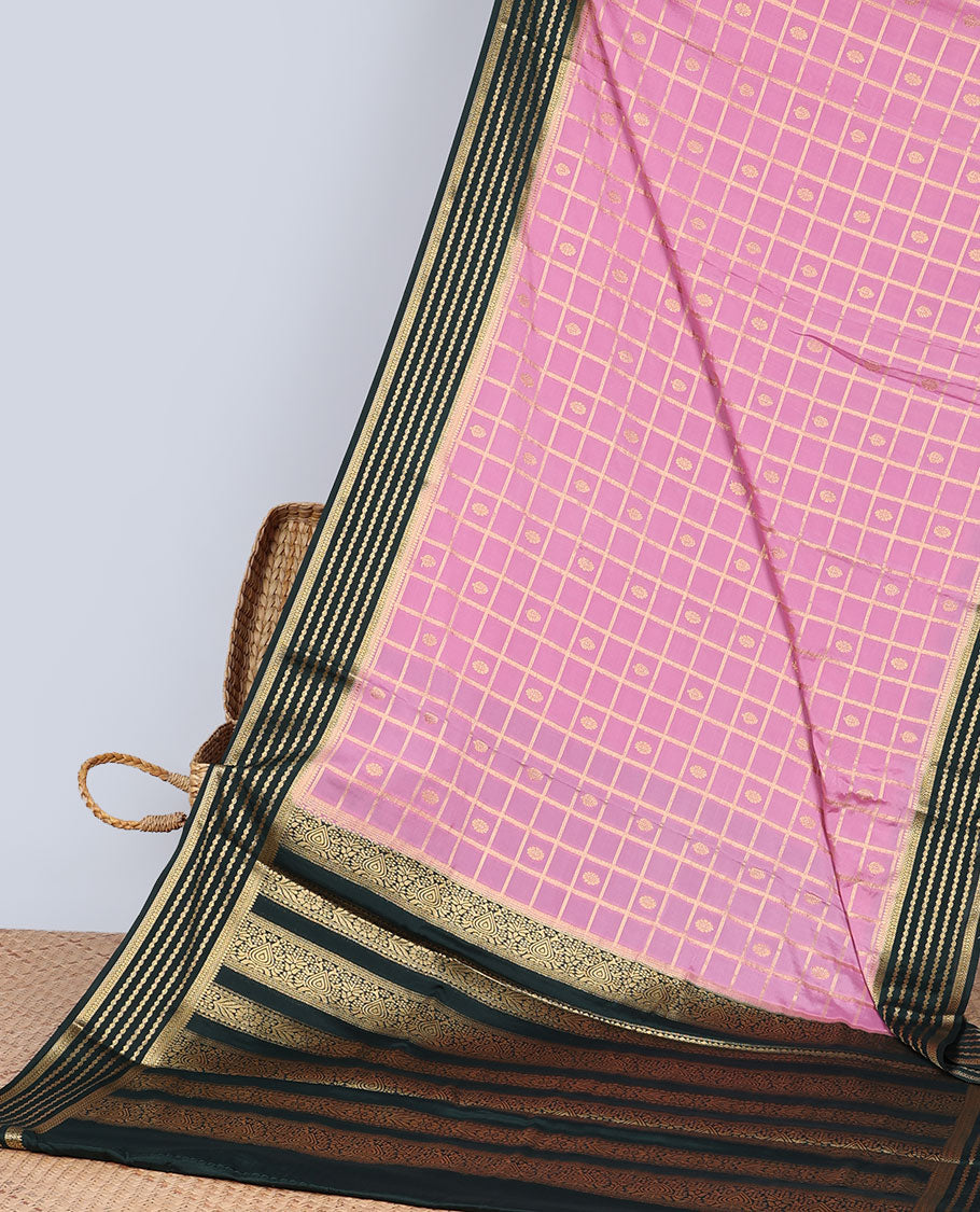 Pink floral motifs enclosed checked with contrast striped zari border & pallu of intricate design