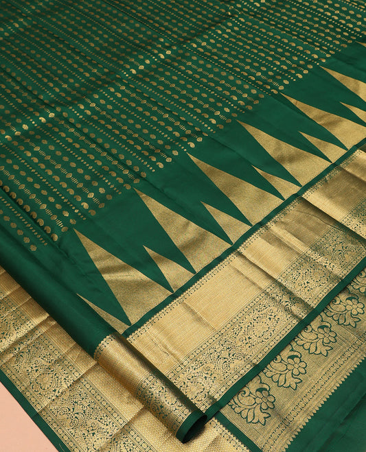 Green Vasundhara Silk Saree, Woven with Zari Buttas, a Zari Thazampoo Rekku Border of Kuyil Kann, Muthu, Star Vanki, and Jada Nagam Designs, Grand Pallu, and a Matching Blouse