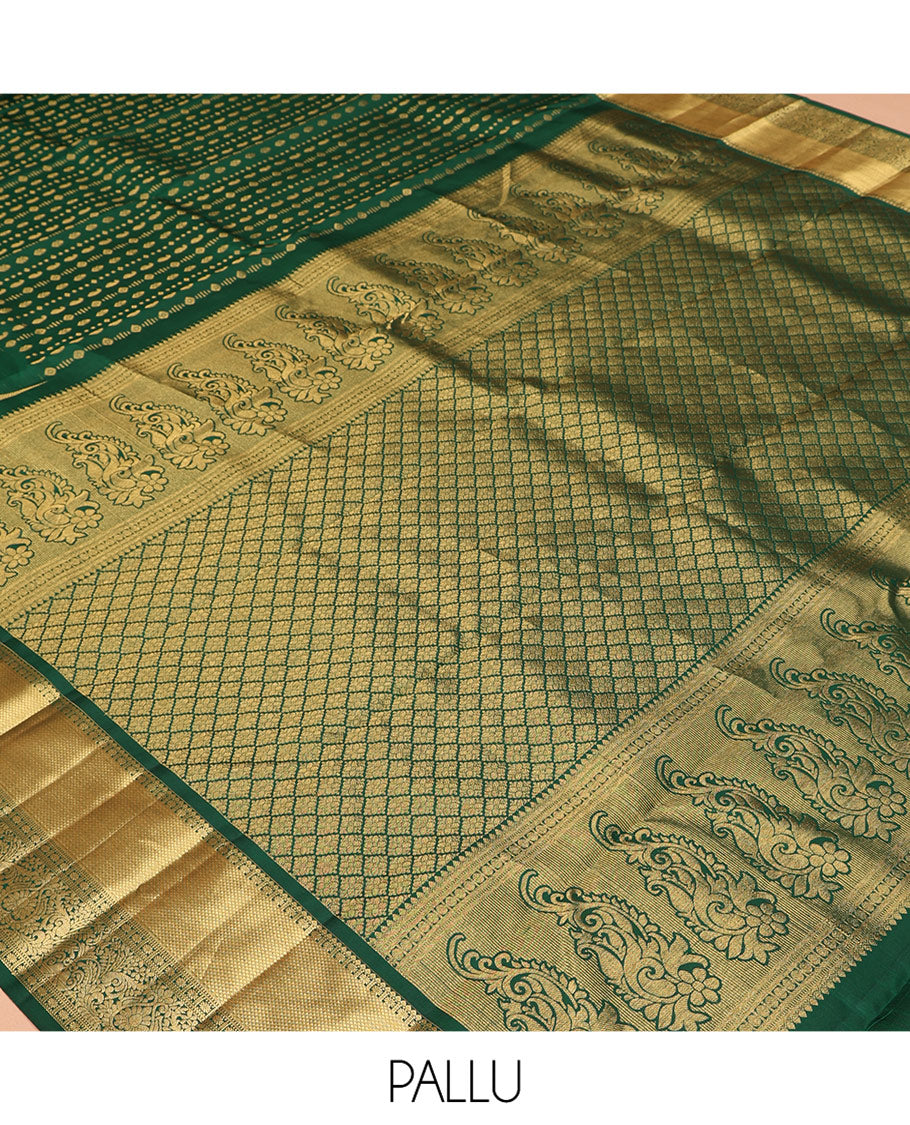 Green Vasundhara Silk Saree, Woven with Zari Buttas, a Zari Thazampoo Rekku Border of Kuyil Kann, Muthu, Star Vanki, and Jada Nagam Designs, Grand Pallu, and a Matching Blouse
