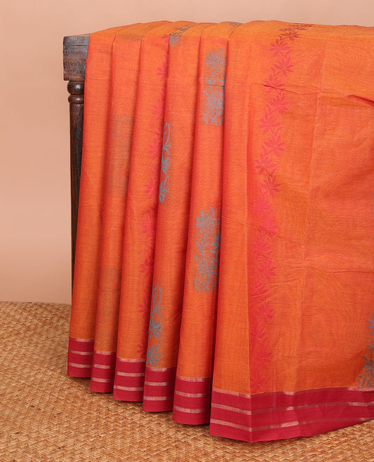 Orange Combatiore cotton saree with floral buttas, contrast striped border & floral design pallu