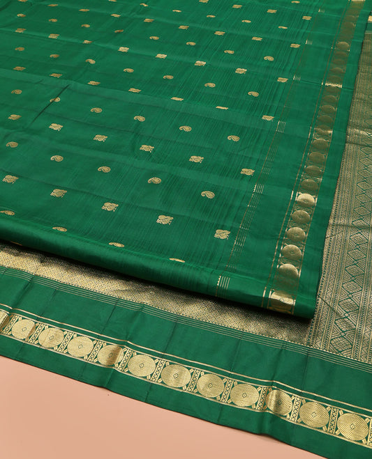 Green Vasundhara Lite Silk Mix Saree, Artfully Detailed with Zari Buttas on Its Body, Highlighted by a Zari Border of Rekku, Muthu, and Poun Designs, Grandly Decked Up Jaal-Patterned Pallu, and Paired with a Matching Blouse