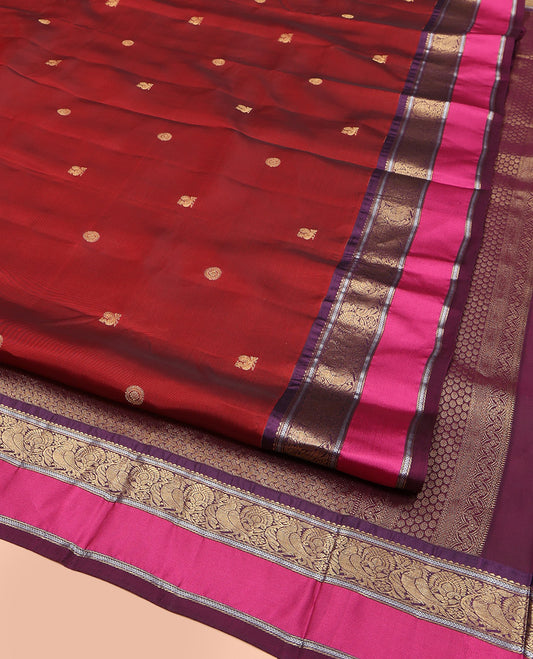 Maroon Vasundhara Lite Silk Mix Saree, Accentuated with Annam Chakram Zari Buttas, Complemented by a Contrast Rettai Pettu Border of Rekku, Kathir, and Mayil Designs, Meticulously Designed Pallu, and Paired with a Contrast Blouse