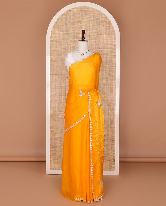 Orange  stone embroidered motifs designer saree, scallop crystal stone embroidered border