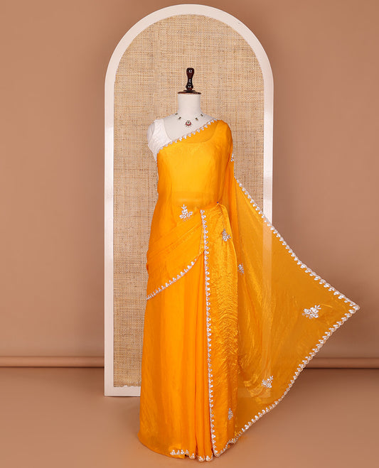 Orange  stone embroidered motifs designer saree, scallop crystal stone embroidered border
