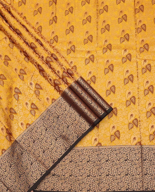 Mustard Art Silk Pavadai Material Set Mesmerized with Leaf Jacquard Design on Its Skirt, Complemented by a Contrast Floral Zari Design Border, and Paired with a Contrast Blouse