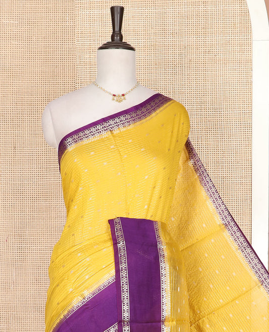 Yellow zari buttas and stripes assam silk saree, contrast traditional zari border, and zari design pallu