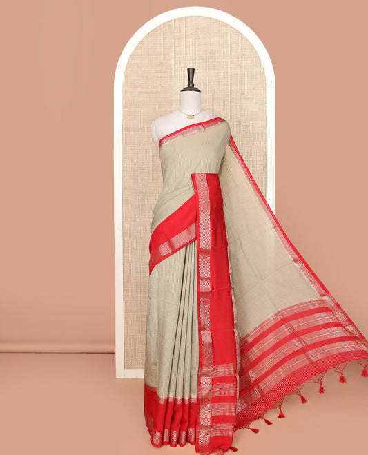 Grey Assam Silk Saree Elegantly Sparkled with Zari Checks, Complemented by Contrast Zari Border of Triangle Motifs, a Gleaming Pallu of Zari Stripes, and Paired with a Contrast Blouse