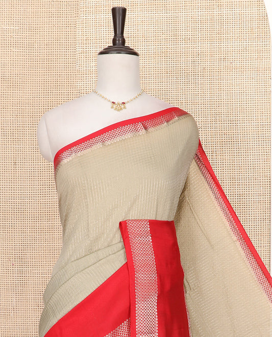 Grey Assam Silk Saree Elegantly Sparkled with Zari Checks, Complemented by Contrast Zari Border of Triangle Motifs, a Gleaming Pallu of Zari Stripes, and Paired with a Contrast Blouse
